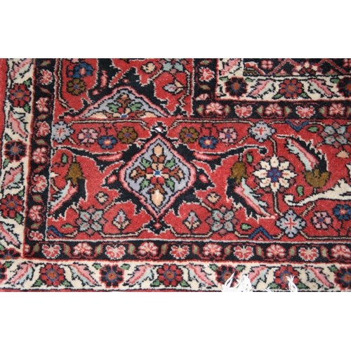 543 - Persian Bidjar style rug, the red ground with large cream gul with smaller red gul to the interior, ... 