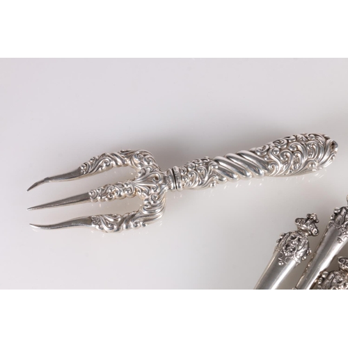 20M - Set of six Italian 800 grade silver fish or fruit knives with mask terminals, an ornate silver tride... 