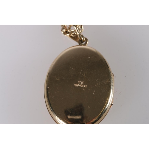 244 - 9ct gold oval pendant locket on 9ct gold neck chain, 16g gross.