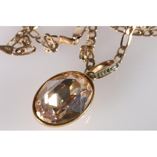 245 - Swarovski pendant on 9ct gold flattened curb link neck chain, the chain 8.5g. 