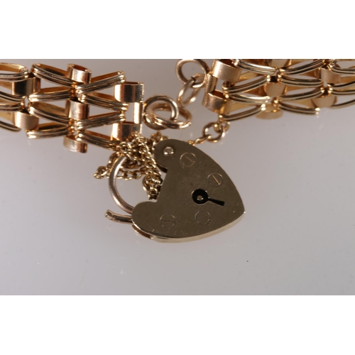 256 - 9ct gold gatelink bracelet with heart shaped padlock closure, 14.7g gross. 