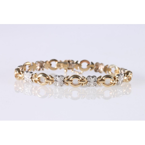 258 - 9ct white and yellow gold bracelet set with diamonds, 12.7g gross. 