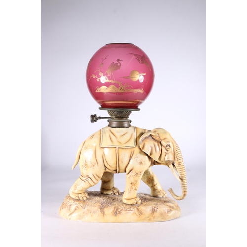 444 - Continental porcelain oil lamp in the form of an elephant, in the manner of Alfred Stellmacher, blue... 