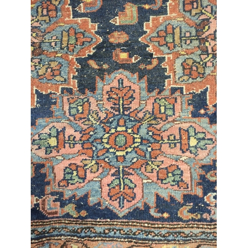 222 - Antique Kurdistan / Turkish hand knotted rug with geometric medallions to the centre with further mo... 