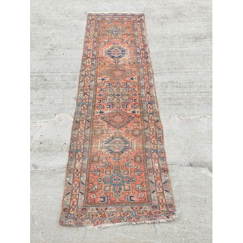 223 - Antique Kurdistan / Turkish hand knotted runner with assorted geometric medallions to the centre wit... 