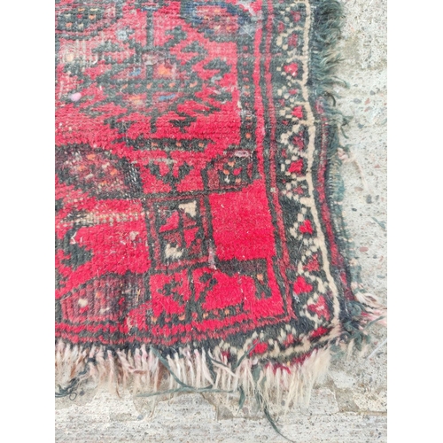 224 - Turkish Belouch hand knotted rug with allover geometric motifs to the centre with further geometric ... 