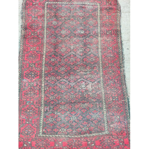 224 - Turkish Belouch hand knotted rug with allover geometric motifs to the centre with further geometric ... 