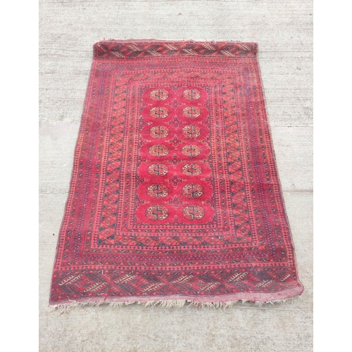 225 - Antique Turkoman hand knotted rug with seven rows of two geometric medallion to the centre, with fur... 