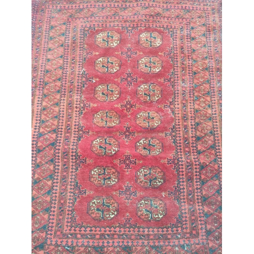 225 - Antique Turkoman hand knotted rug with seven rows of two geometric medallion to the centre, with fur... 