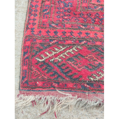 225 - Antique Turkoman hand knotted rug with seven rows of two geometric medallion to the centre, with fur... 