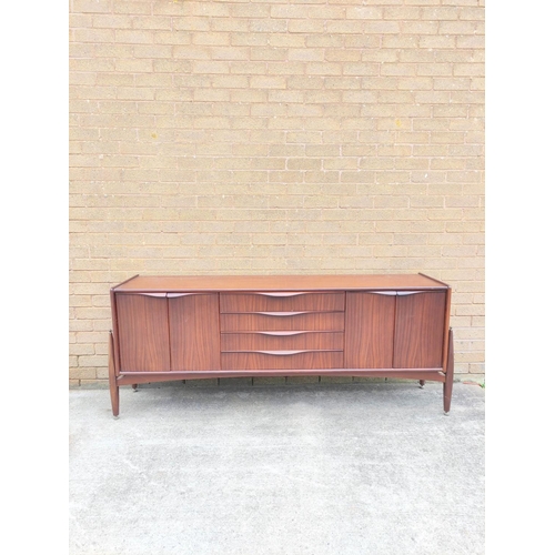 395 - Mid Century teak sideboard by Badcocks House Furnishers Newton Abbot, with four central drawers flan... 