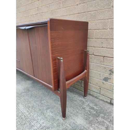 395 - Mid Century teak sideboard by Badcocks House Furnishers Newton Abbot, with four central drawers flan... 