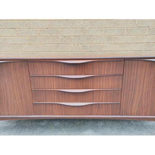 395 - Mid Century teak sideboard by Badcocks House Furnishers Newton Abbot, with four central drawers flan... 