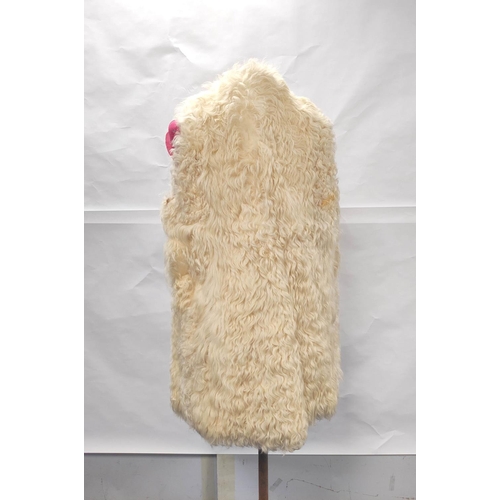 196 - Vintage cream angora mohair goatskin long waistcoat or gillet; also a vintage Alexon black faux fur ... 