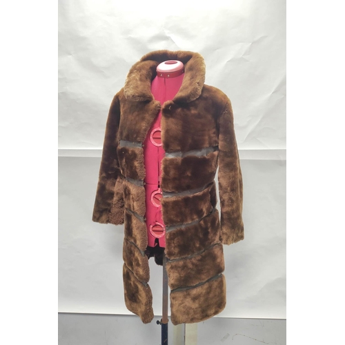 205 - Vintage banded brown sheepskin and leather coat, no labels, approx. size 8/10?; also a child's sheep... 