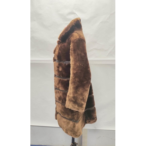 205 - Vintage banded brown sheepskin and leather coat, no labels, approx. size 8/10?; also a child's sheep... 