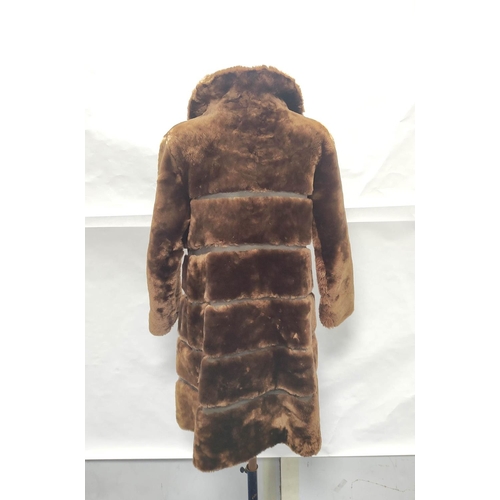 205 - Vintage banded brown sheepskin and leather coat, no labels, approx. size 8/10?; also a child's sheep... 