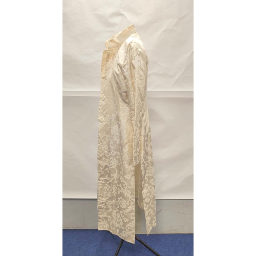 211 - Modern Chinese cream silk trouser suit comprising long floral brocade jacket with raw silk trousers.