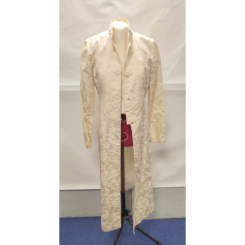 211 - Modern Chinese cream silk trouser suit comprising long floral brocade jacket with raw silk trousers.