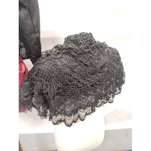 213 - Victorian or Edwardian lady's black silk short cape with beaded and appliqued floral scroll decorati... 