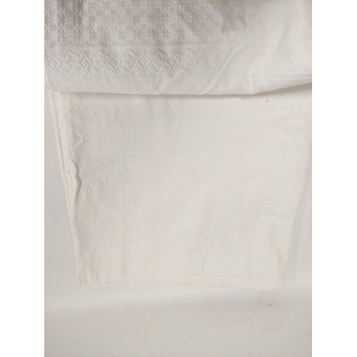 217 - Woven white cotton bedspread, approx. 215cm x 220cm; a set of twelve embroidered cutwork white linen... 