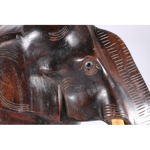 348 - Large carved hardwood model of an elephant, 40cm tall, 47cm long. 