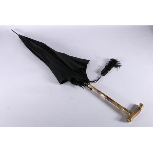 349 - Antique parasol or umbrella, the horn handle possibly Rhino horn with 18ct gold plated mounts, one o... 