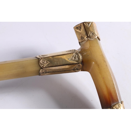 349 - Antique parasol or umbrella, the horn handle possibly Rhino horn with 18ct gold plated mounts, one o... 