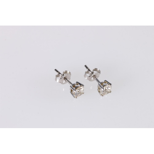 249A - Pair of 9ct white gold diamond solitaire ear studs, the diamonds approximately 0.3ct stones each, 0.... 