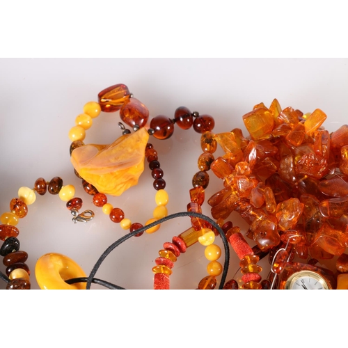 263 - Vintage amber jewellery including necklaces, pendant, bracelets and a wristwatch. 