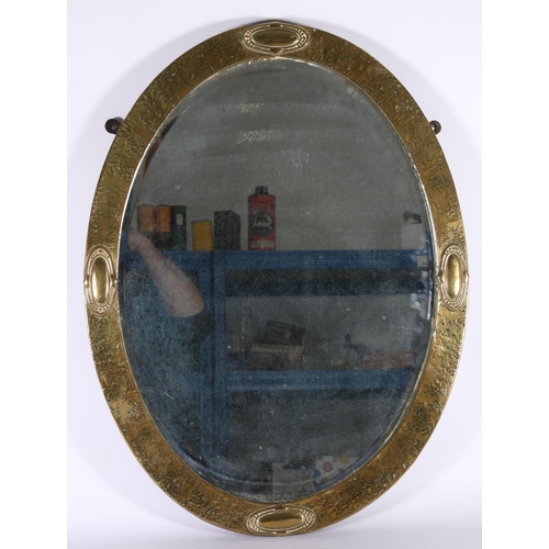 369 - Arts & Crafts oval brass mirror with copper rivets, oval bevelled glass, 50cm x 64cm. 