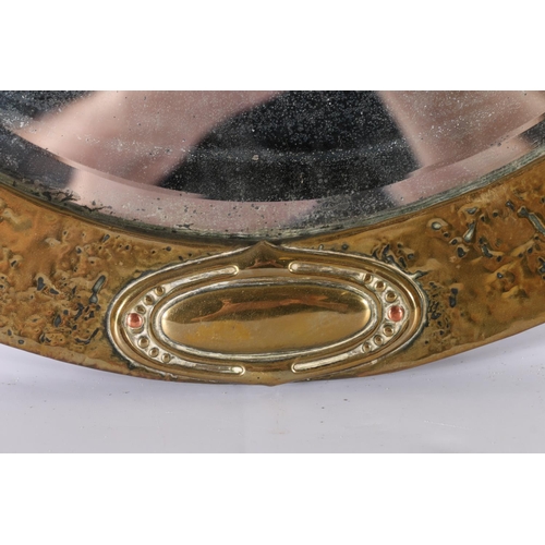 369 - Arts & Crafts oval brass mirror with copper rivets, oval bevelled glass, 50cm x 64cm. 