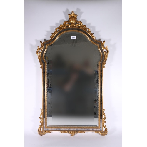 370 - Contemporary antique style wall mirror, the arch top with carved scroll surmount, bevelled glass, 10... 