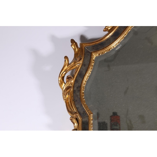 370 - Contemporary antique style wall mirror, the arch top with carved scroll surmount, bevelled glass, 10... 