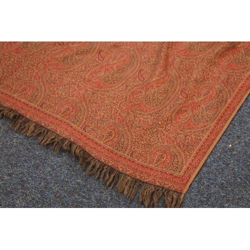 381 - Paisley patterned shawl of typical style, the red ground decorated with boteh, 200cm x 100cm.