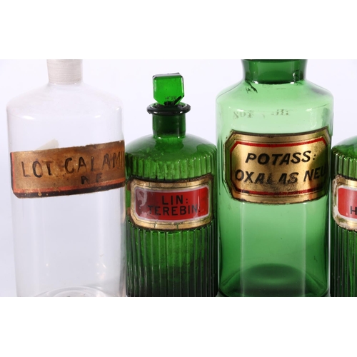 407 - Pair of reeded green glass apothecary or chemists jars with enamelled labels for Hyoscy and Ter... 