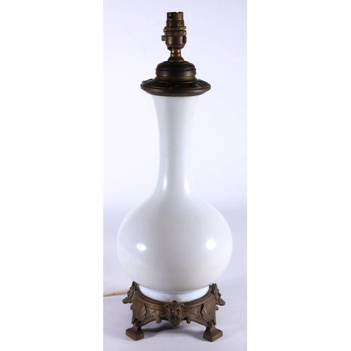 408 - Antique baluster shaped milk glass table lamp with metal mounts, 48cm tall. 