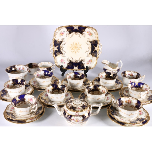 448 - Harlequin set of Coalport English porcelain cobalt blue gilt and hand-painted floral batwing pattern... 