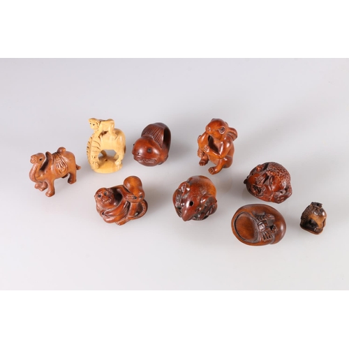 488 - Nine carved wood netsuke including camel, monkey and octopus, rat, rabbit with carrot, crab and snai... 