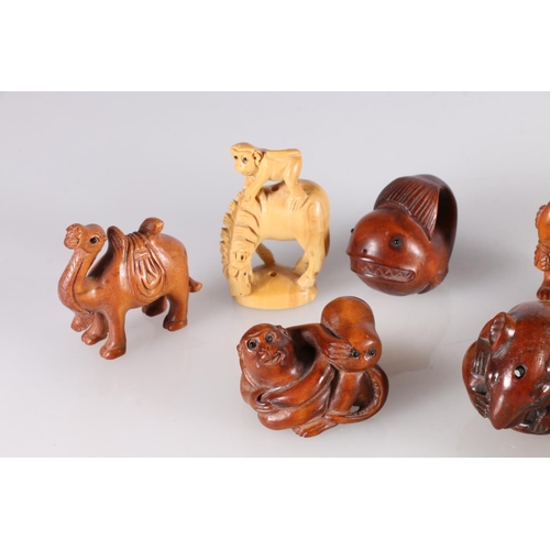 488 - Nine carved wood netsuke including camel, monkey and octopus, rat, rabbit with carrot, crab and snai... 