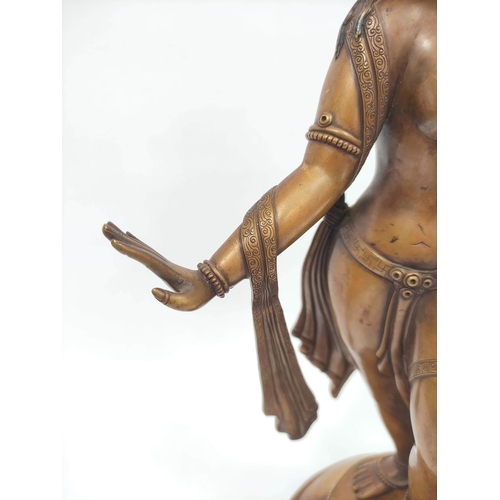 360 - Sino-Tibetan patinated bronze figure of a female deity standing on oval lotus plinth base, 39cm high... 