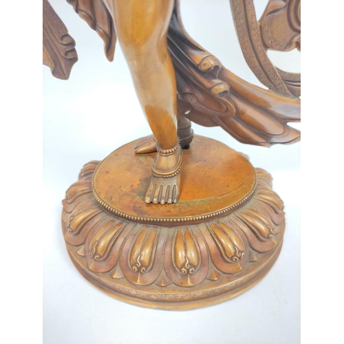 360 - Sino-Tibetan patinated bronze figure of a female deity standing on oval lotus plinth base, 39cm high... 