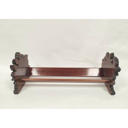 414 - Victorian mahogany book trough with carved floral ends. 19 cm high, 50.5cm wide, 19.5cm deep.