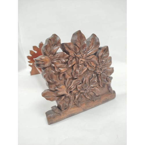 414 - Victorian mahogany book trough with carved floral ends. 19 cm high, 50.5cm wide, 19.5cm deep.