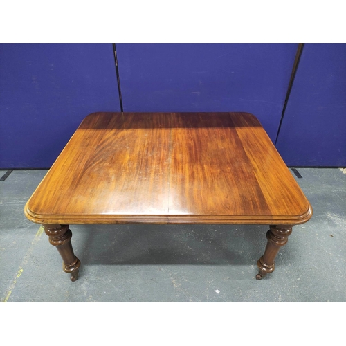 417 - Victorian mahogany extending dining table with three additional leaves on baluster supports with cas... 