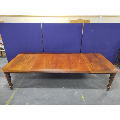 417 - Victorian mahogany extending dining table with three additional leaves on baluster supports with cas... 