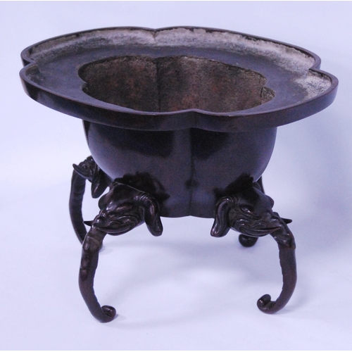 241 - Japanese bronze quatrefoil koro, Meiji (1868 - 1912), with plain ribbed body, on four elephant head ... 