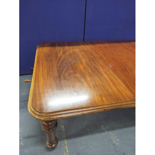 417 - Victorian mahogany extending dining table with three additional leaves on baluster supports with cas... 