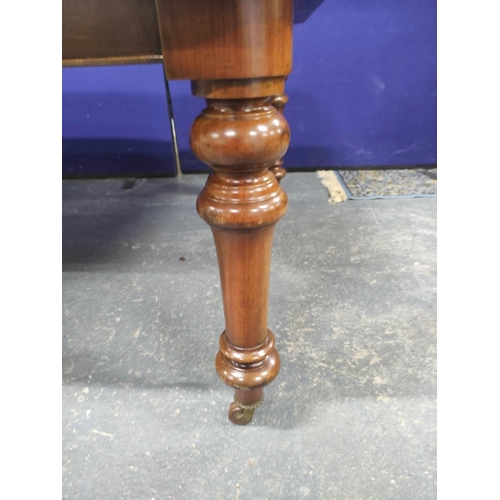 417 - Victorian mahogany extending dining table with three additional leaves on baluster supports with cas... 