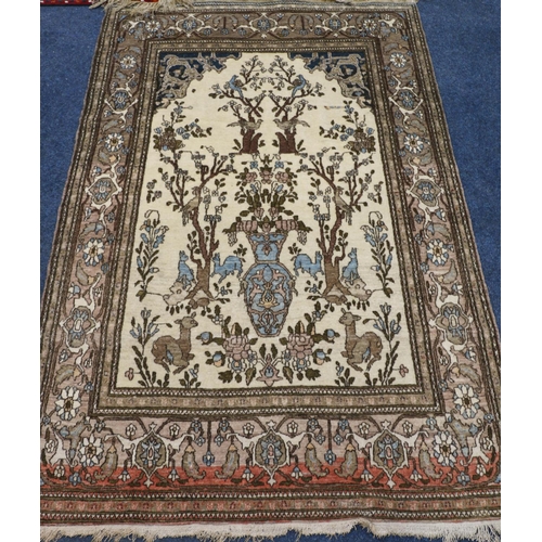 549 - Indian/ Iranian Isfahan style rug, the cream ground decorated with of flowers, animals and trees, mu... 